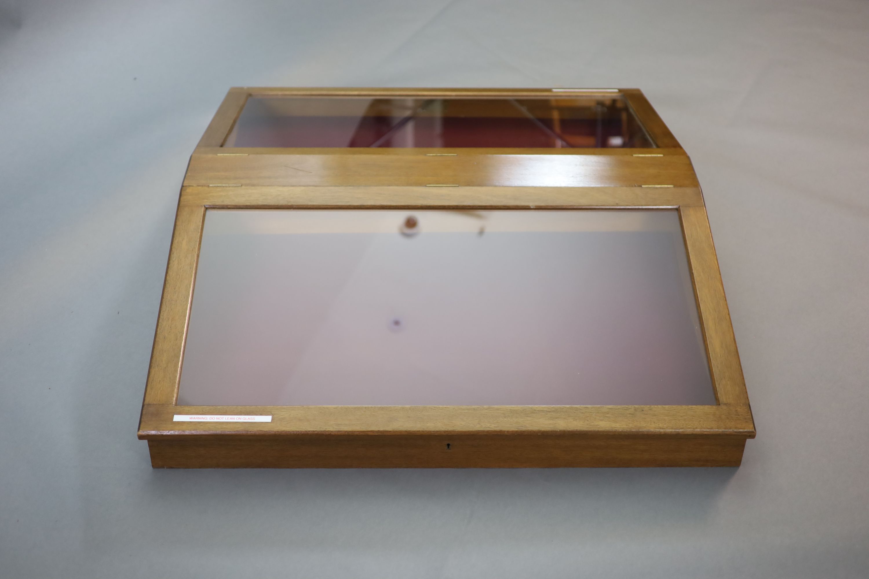 A 20th century teak table top double display case, from the Library of the Royal College of Surgeons, width 103cm depth 128cm height 108cm